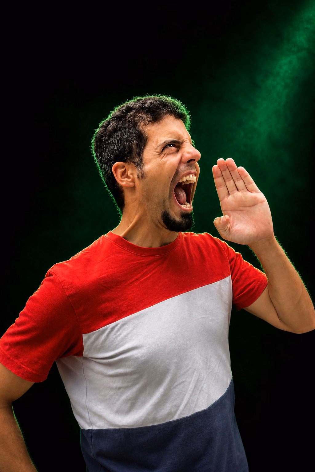 Joao calling out against a green-lit stage backdrop