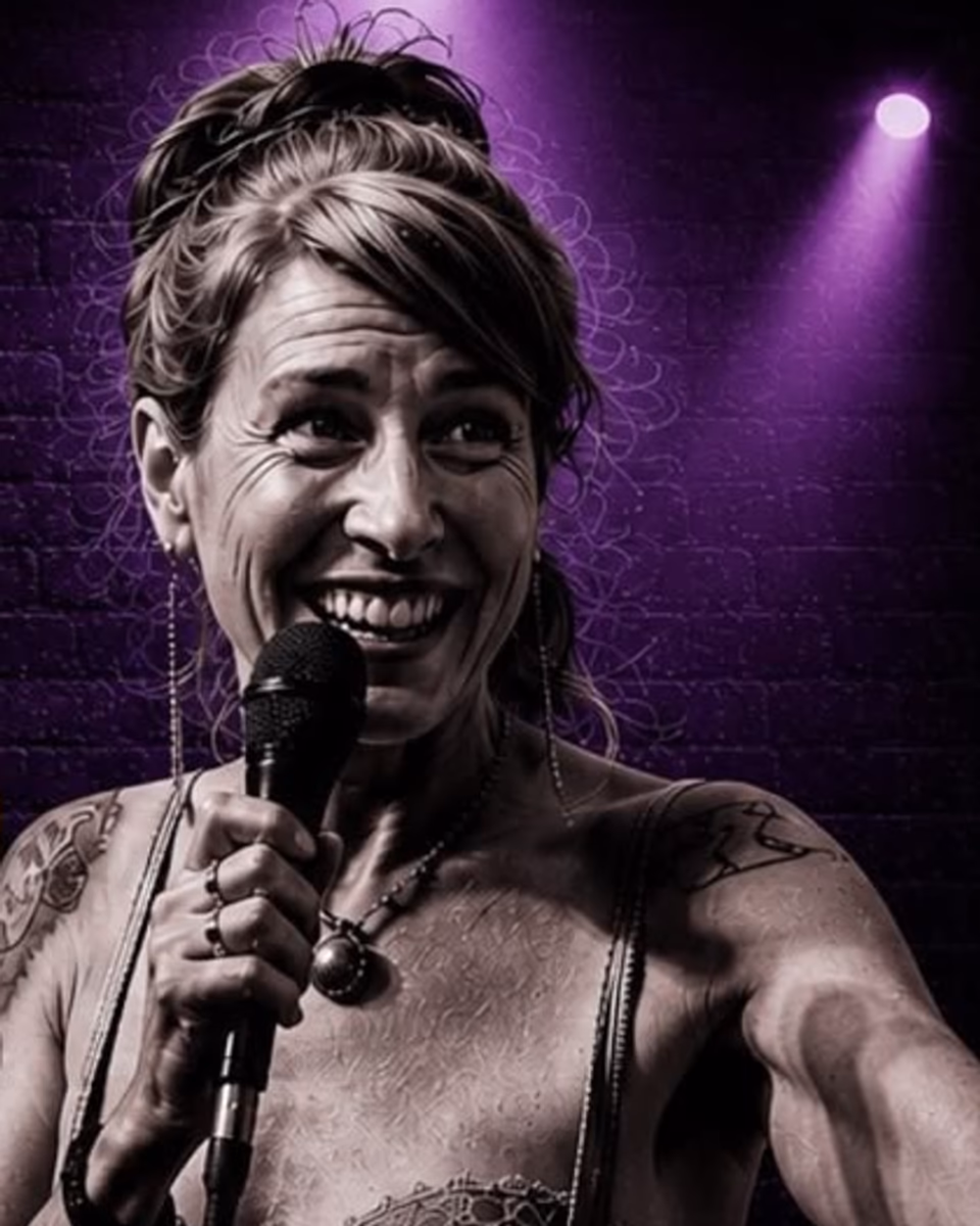 Pam Benjamin performing with a microphone under purple stage lights