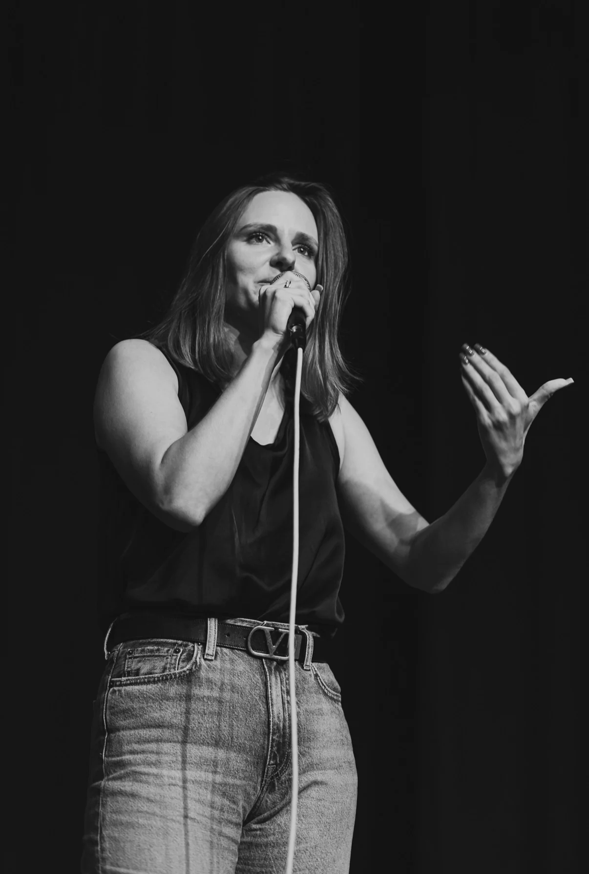 Daria Makarskaya performing stand-up comedy onstage